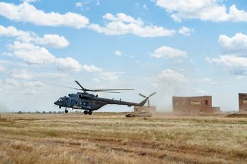 Flying military transport helicopter special for army soldier in fight war. Military soldier volant in transport helicopter above clean blue sky. Helicopter is military transport to army soldier