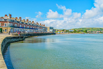 Fototapeta na wymiar Swanage shimmering seafront on a bright June day