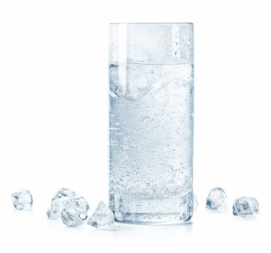 Glass of cold sparkling water and ice