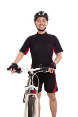 One cheerful cycling guy standing with his bike and smiling at camera, isolated on white background