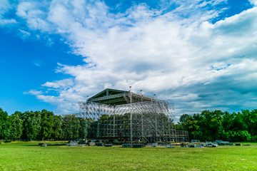 Assembling the big stage on grass of stadium