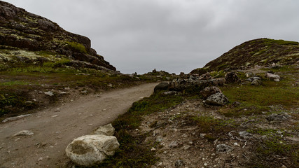 Fototapeta na wymiar The road through the tundra of the Kola Peninsula