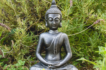 Buddha statue in a green garden