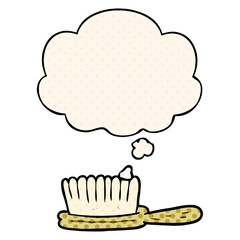 cartoon hairbrush and thought bubble in comic book style