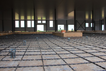 Fiberglass fittings laid on a concrete base floor.