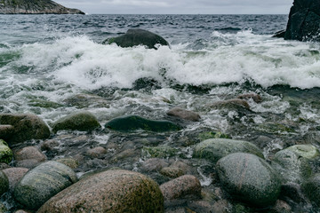 Barents Sea cold water beating against the rocky shore