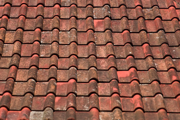 Old red and orange weathered roof tiles texture