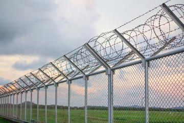 wire mesh steel with green grass background in Phuket Thailand