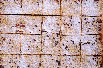 Pieces of homemade cookies apricot jam powdered sugar texture close up