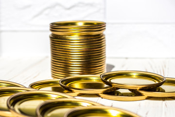 Metal caps for preserving food in cans for the winter, on a white background.
