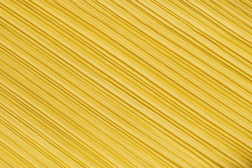 Closeup abstract pattern at yellow women's clothing textured background