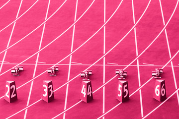 Starting blocks in track and field. Pink color filter