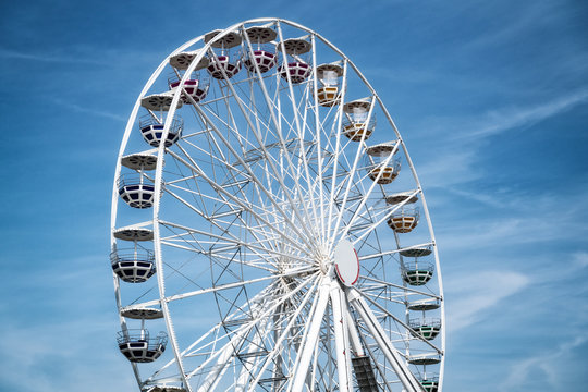 Ferris Mill, big  wheel on a background of blue sky.