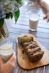 Vegan banana bread with green buckwheat and glass oat milk.