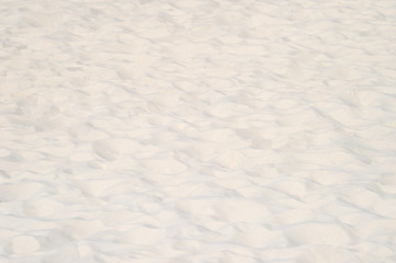 closeup of sand pattern of a beach in the summer