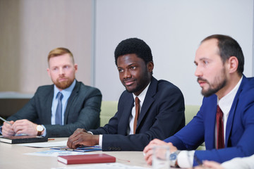 African businessman and his Caucasian colleagues or partners