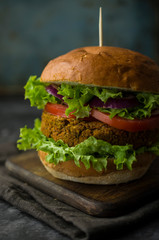 Vegan burger with vegetables and lettuce