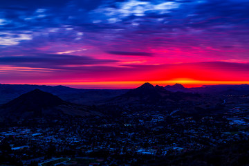 Red Sunset over Silhouetted Mountains