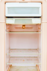 Interior of a retro pink fridge