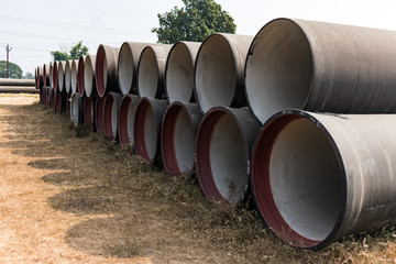 ductile iron pipes stocked in open space of a rural village store yard. - 276203021