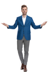 Positive casual man greeting with his hands wide open