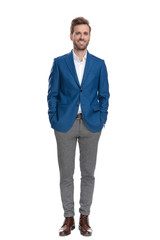 Relaxed casual guy holding both hand in his pockets