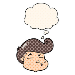 cartoon boy's face and thought bubble in comic book style