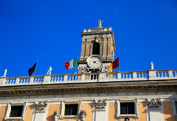Palazzo Senatorio on Piazza del Campidoglio, on the top of Capitoline Hill with Vatican, Italian and European flag in Rome, Italy