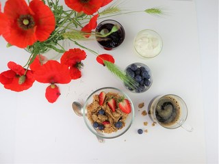 Breakfast served with coffee, cereals and fruits.