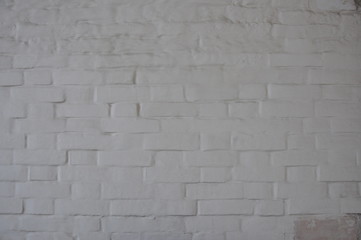 Antique white brick wall covered with paint.