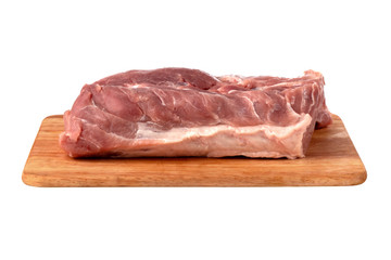 A piece of meat on a white background. Raw piece of pork on a wooden board.