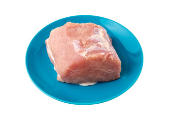 A piece of meat on a white background. Raw piece of pork on a plate close-up.