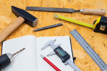 Several tools on a wooden table