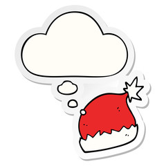 cartoon santa hat and thought bubble as a printed sticker