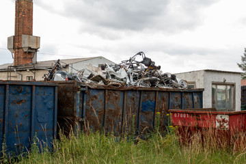 Fototapeta na wymiar Metal scrap is located in large containers