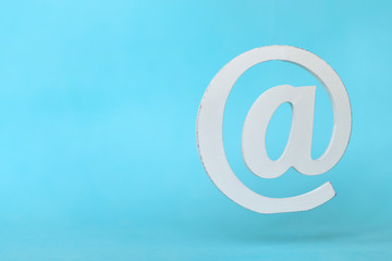 floating email sign on blue background with real shadow. Concept for email, communication or contact us