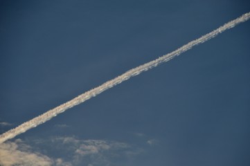 Airplane contrails in the evening sky over Berlin and Brandenburg of September 12, 2015, Germany