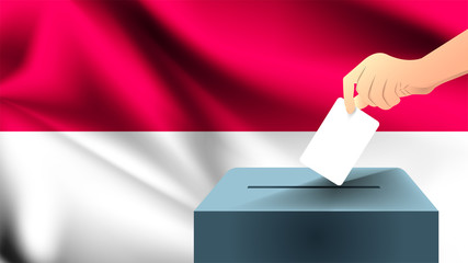 Male hand puts down a white sheet of paper with a mark as a symbol of a ballot paper against the background of the Indonesia flag, Indonesia the symbol of elections