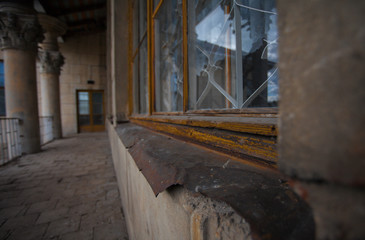 Fototapeta na wymiar old window sill in an abandoned house of culture