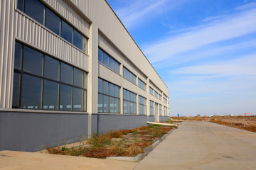 Fototapeta na wymiar Factory building under blue sky