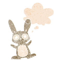cute cartoon rabbit and thought bubble in retro textured style