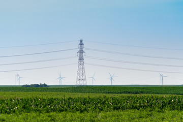 Power transmission lines and towers in the field in countryside