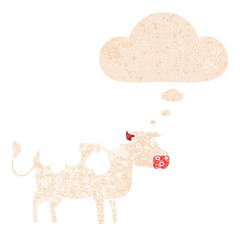 cartoon cow and thought bubble in retro textured style
