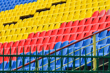 Empty colorful seats in the stands of the stadium. The concept of the end, the beginning of the match, the competition. The end of the season.
