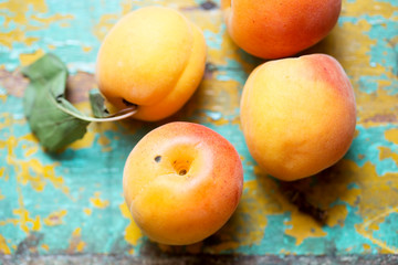 Fresh peaches on blue background