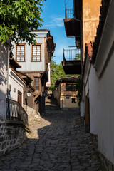  View of a narrow street in  historical part of  Plovdiv Old Town. Typical medieval colorful buildings. Bulgaria