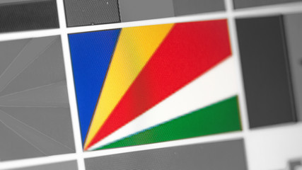 Seychelles national flag of country.Seychelles flag on the display, a digital moire effect.