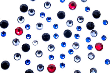 Multi-colored rhinestones isolated on white background
