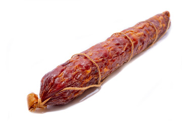 juicy and tasty smoked sausage isolated on white background