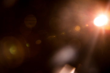 Abstract Natural Sun flare on the black background.